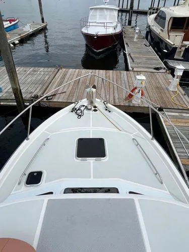 Slide: The Image of Bow view of 2018 True North 34OE boat docked at a marina. - 8