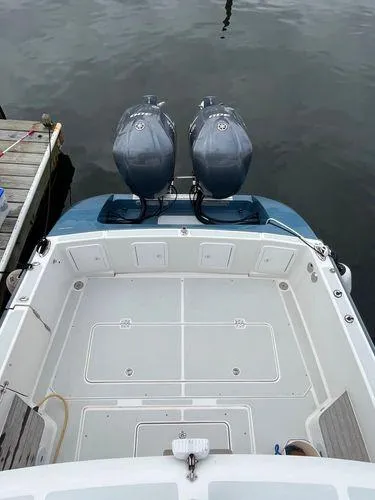 Slide: The Image of 2018 True North 34OE boat with dual outboard motors docked at marina. - 9
