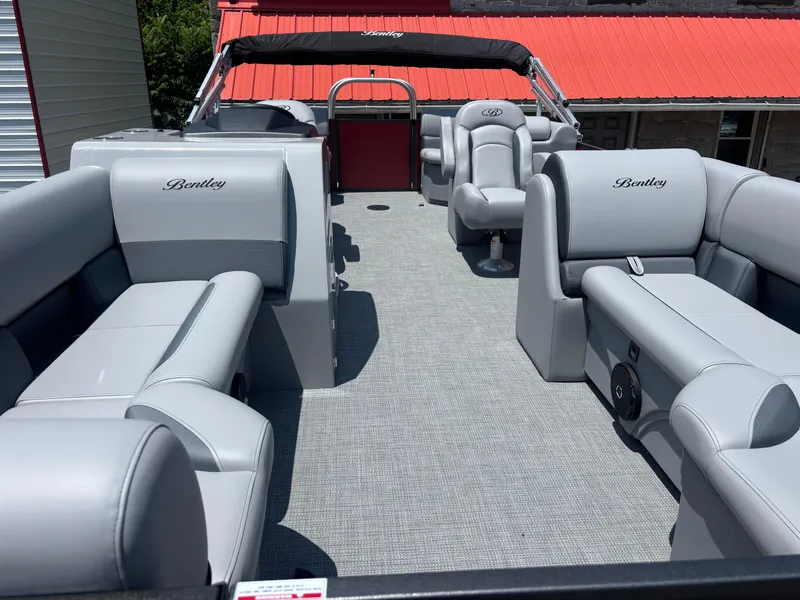 Slide: The Image of 2025 Bentley Pontoons 223 NAVIGATOR interior with luxurious gray seating and spacious layout. - 5