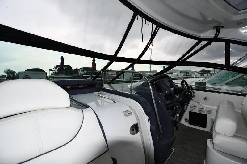 Slide: The Image of 2019 Cruisers Yachts 380 Express interior with helm and seating area. - 11