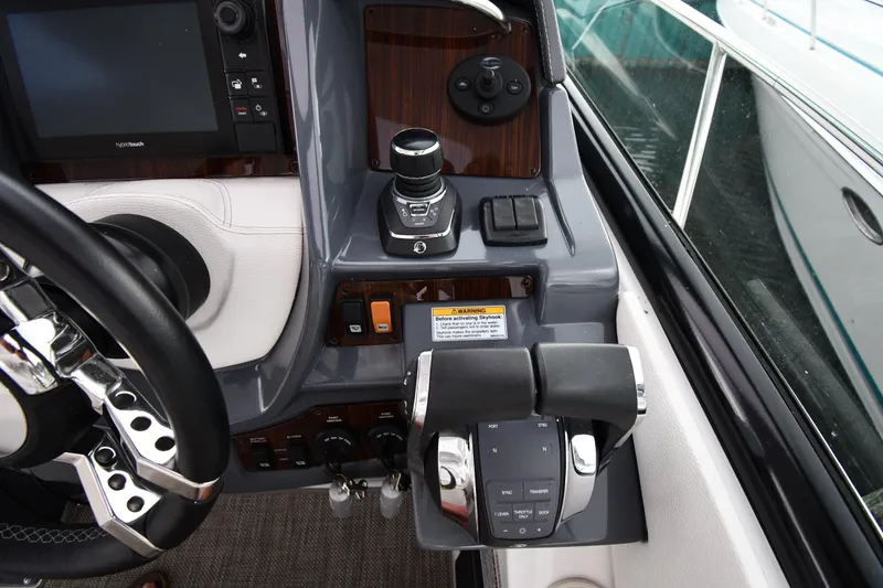 Slide: The Image of 2019 Cruisers Yachts 380 Express helm with controls and navigation equipment. - 15