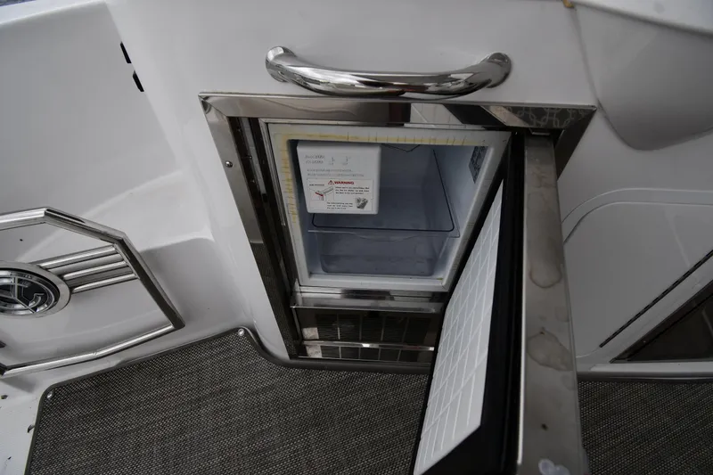 Slide: The Image of Open refrigerator on 2019 Cruisers Yachts 380 Express boat deck. - 25