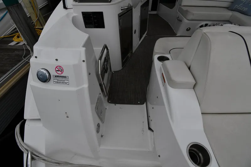 Slide: The Image of 2019 Cruisers Yachts 380 Express interior with seating and cup holders. - 27