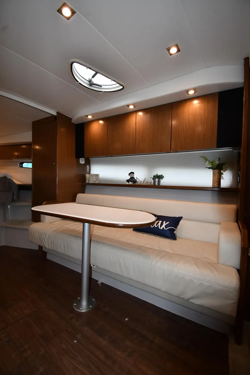 Slide: The Image of Interior of 2019 Cruisers Yachts 380 Express with cozy seating and modern lighting. - 38
