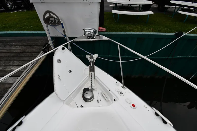 Slide: The Image of 2019 Cruisers Yachts 380 Express bow with anchor and dock view. - 4