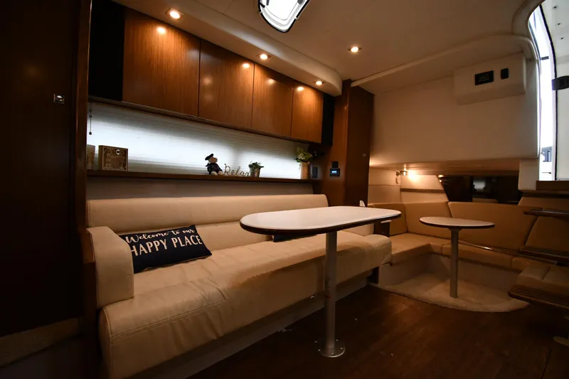Slide: The Image of 2019 Cruisers Yachts 380 Express interior with cozy seating and elegant lighting. - 43