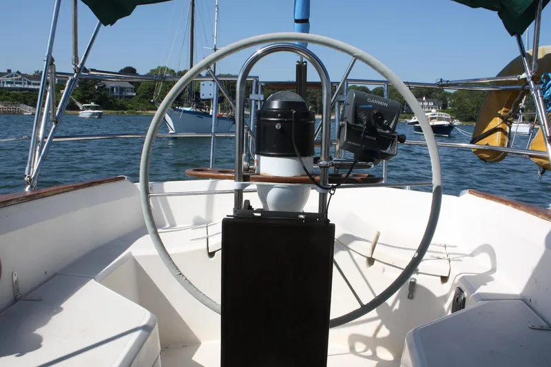 Slide: The Image of Cockpit view of 1986 Sabre 34 MK II sailboat with steering wheel and Garmin device. - 10
