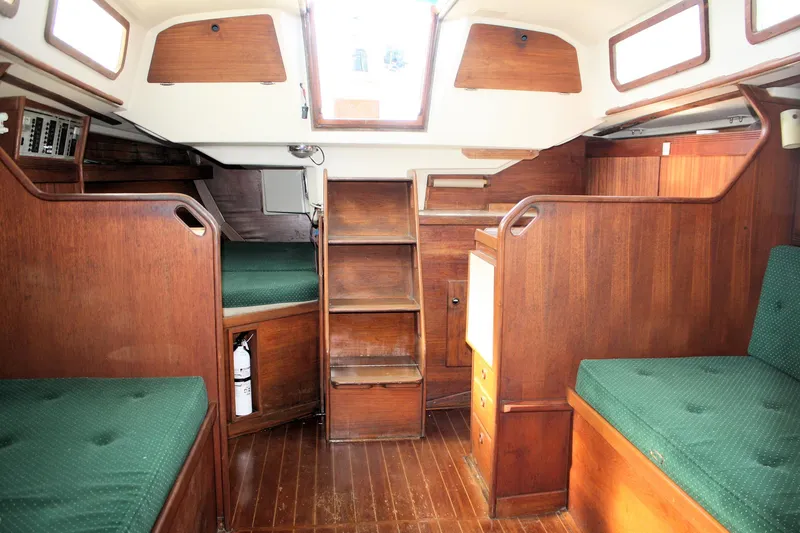 Slide: The Image of Interior of 1986 Sabre 34 MK II sailboat with wooden furnishings and green upholstery. - 20