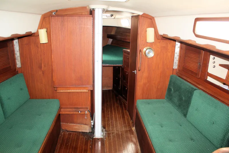 Slide: The Image of Interior of 1986 Sabre 34 MK II sailboat with wooden finish and green upholstery. - 23