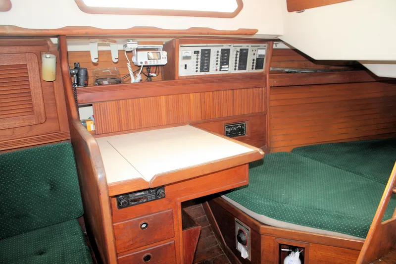 Slide: The Image of 1986 Sabre 34 MK II yacht interior with navigation station and green upholstery. - 28