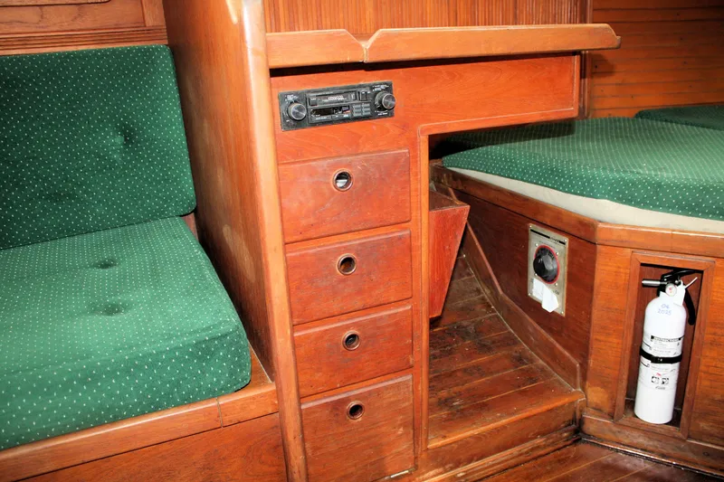 Slide: The Image of Interior of 1986 Sabre 34 MK II sailboat with green cushions and wooden cabinetry. - 29