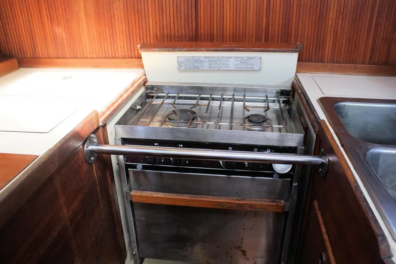 Slide: The Image of 1986 Sabre 34 MK II yacht kitchen with stove and sink. - 30