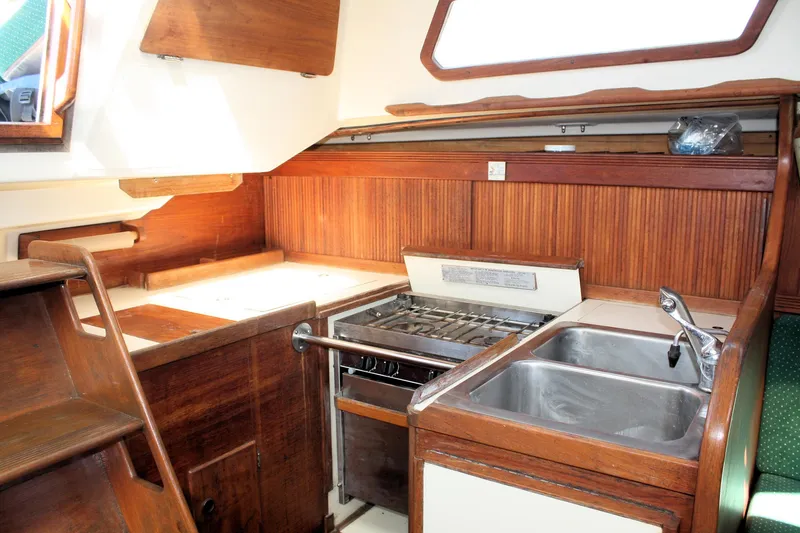 Slide: The Image of Interior of 1986 Sabre 34 MK II sailboat galley with stove and sink. - 32