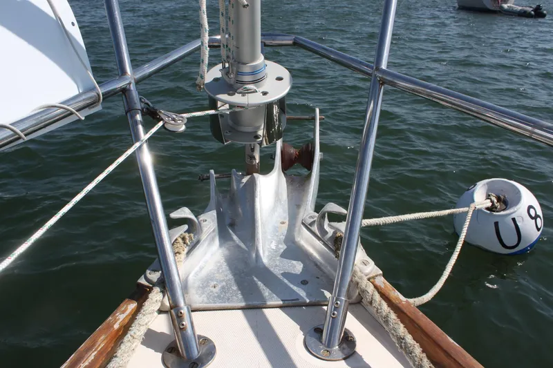 Slide: The Image of Bow of 1986 Sabre 34 MK II sailboat with anchor and mooring buoy. - 4
