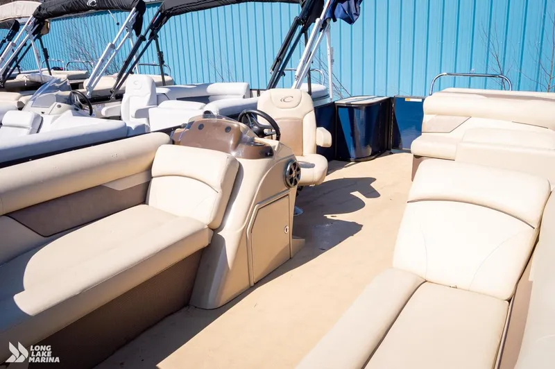 Slide: The Image of 2019 Crest CREST I 220 L pontoon boat with beige seating and steering console. - 10