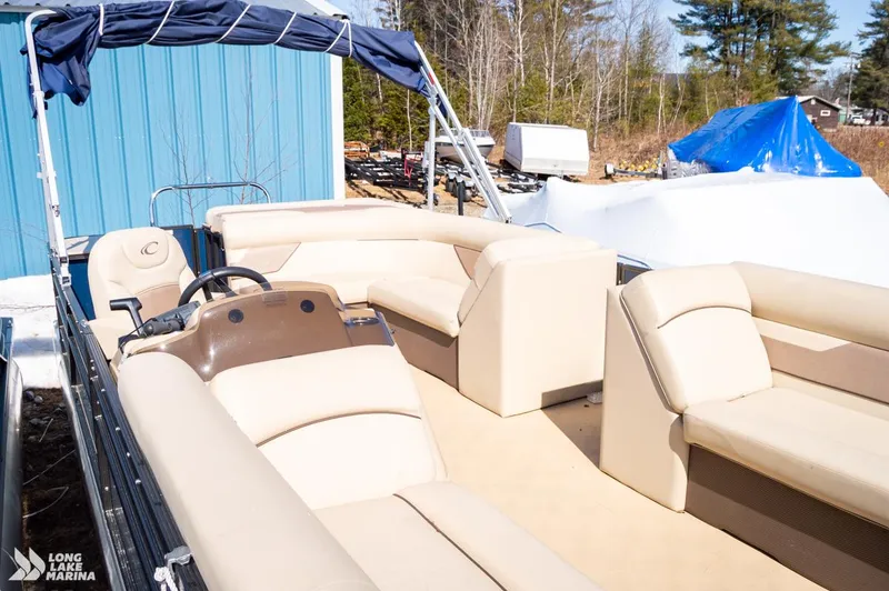 Slide: The Image of 2019 Crest CREST I 220 L pontoon boat with beige seating and blue canopy. - 9