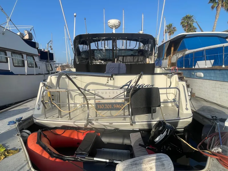 Slide: The Image of 1989 Californian Express boat docked, featuring a sleek design and modern equipment. - 1