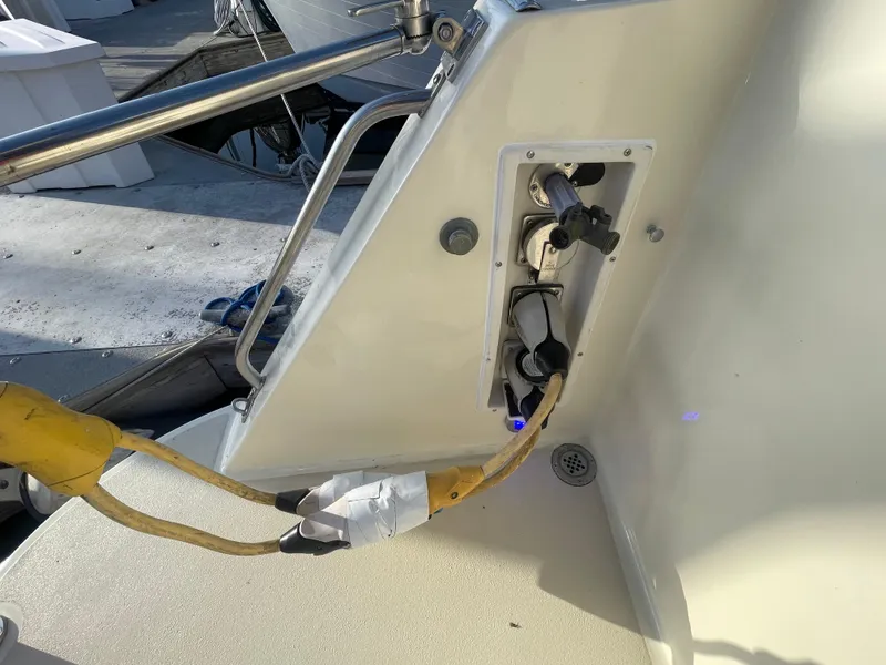 Slide: The Image of 1989 Californian Express boat power connections with yellow cables on deck. - 10