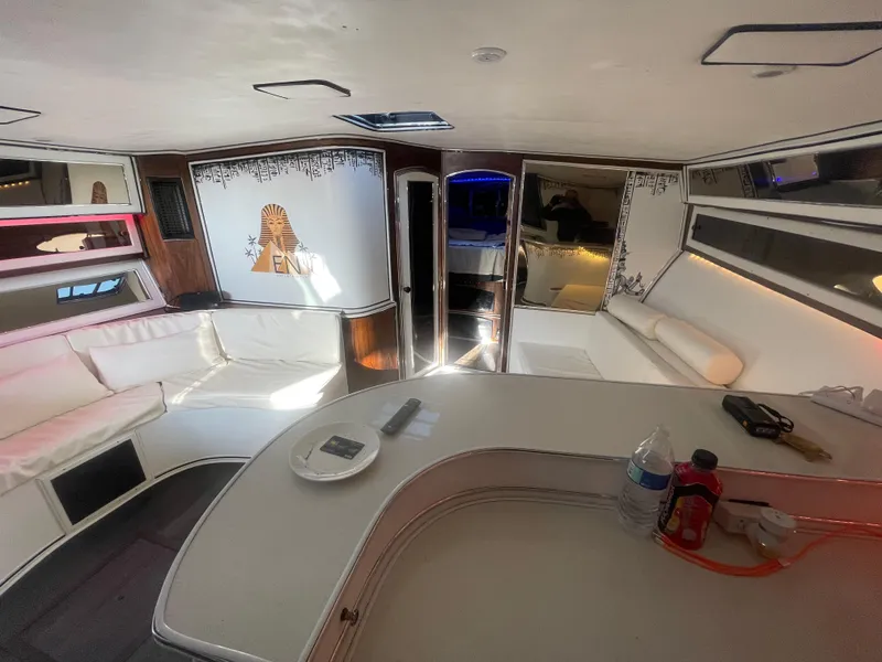 Slide: The Image of Interior of a 1989 Californian Express yacht with white seating and modern decor. - 15