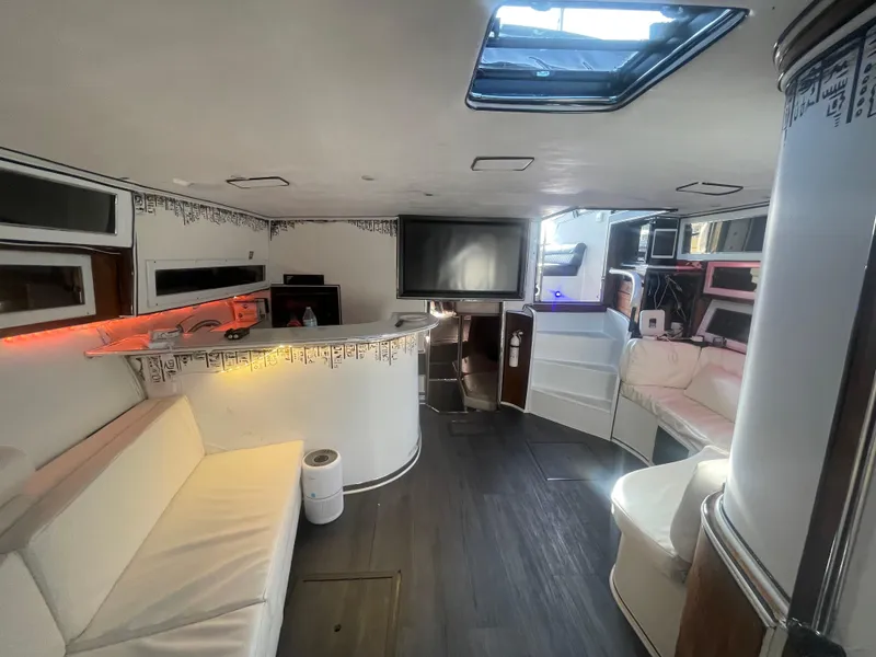 Slide: The Image of Interior of a 1989 Californian Express yacht with modern seating and entertainment area. - 21