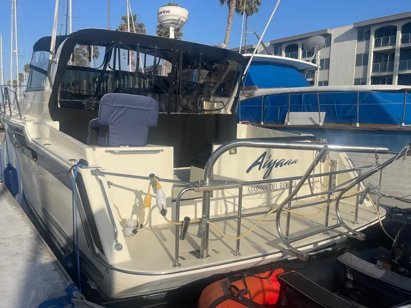 Slide: The Image of 1989 Californian Express yacht docked at Marina del Rey, featuring a spacious deck and modern amenities. - 27