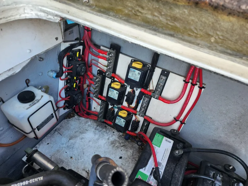 Slide: The Image of Electrical wiring and components inside a 1975 Bertram 28 Flybridge Cruiser boat. - 10