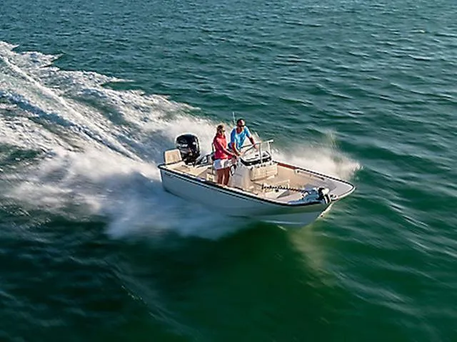 Slide: The Image of 2025 Boston Whaler 170 Montauk cruising on open water with two passengers. - 1