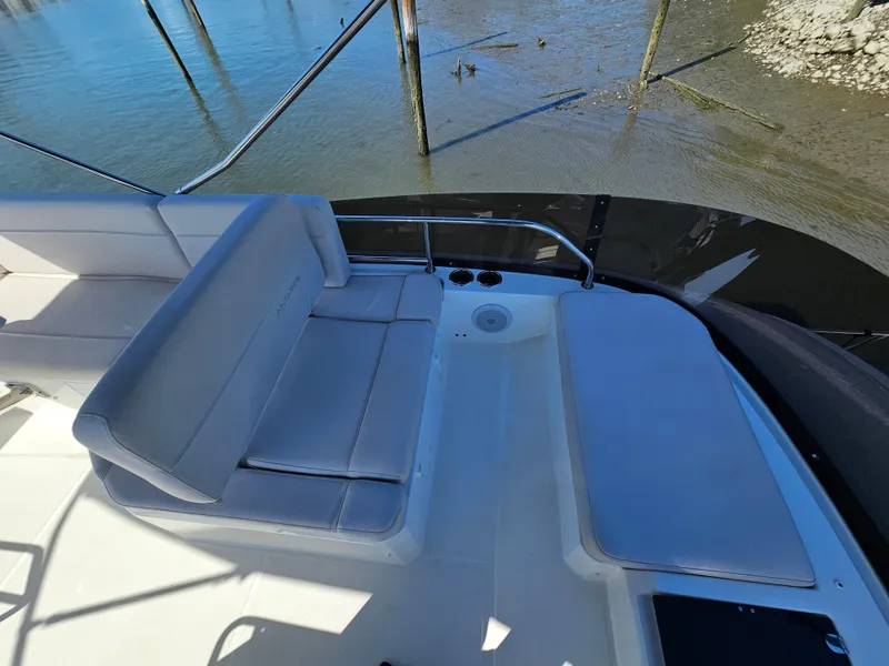 Slide: The Image of 2024 Beneteau Antares 12 boat seating area with water view. - 12