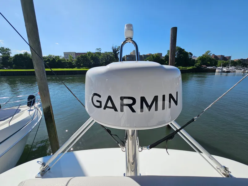 Slide: The Image of 2024 Beneteau Antares 12 with Garmin radar on calm water. - 18