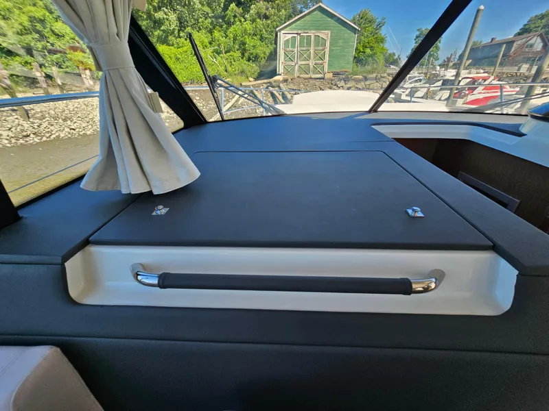 Slide: The Image of Interior view of 2024 Beneteau Antares 12 yacht, featuring sleek design and window curtains. - 32