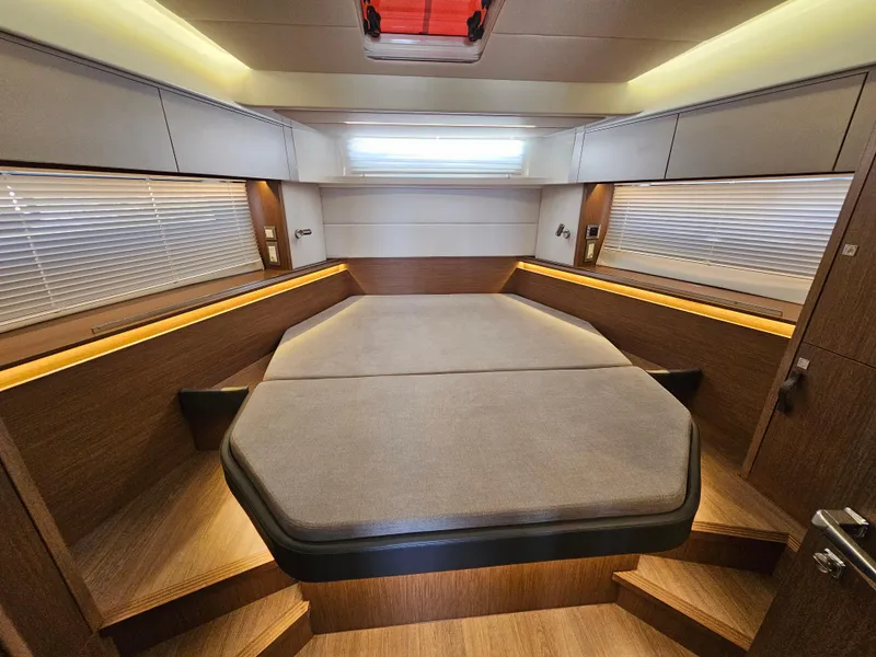 Slide: The Image of Luxurious cabin interior of 2024 Beneteau Antares 12 with modern design and ambient lighting. - 39