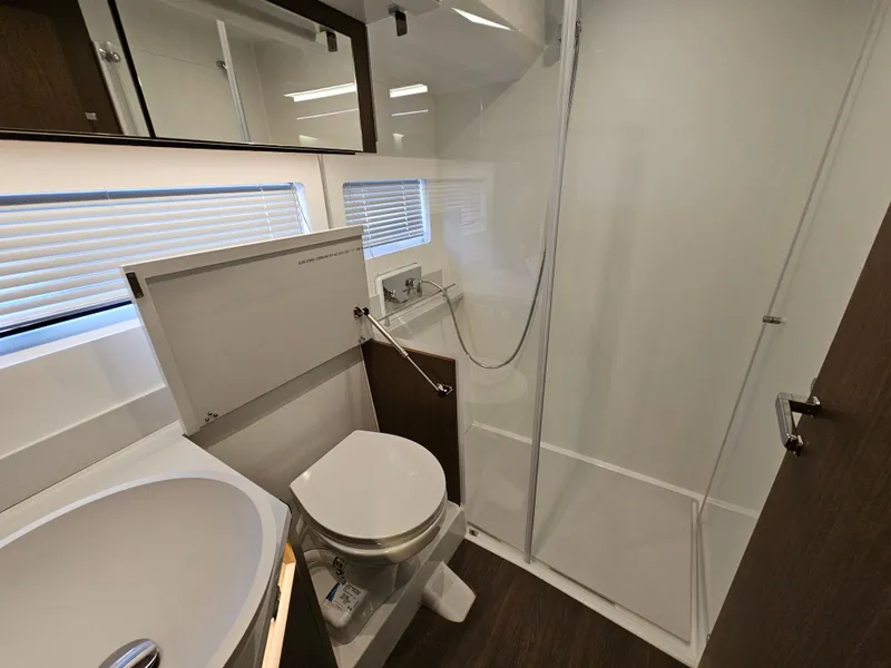 Slide: The Image of Bathroom interior of 2024 Beneteau Antares 12 yacht, featuring modern fixtures and shower. - 40