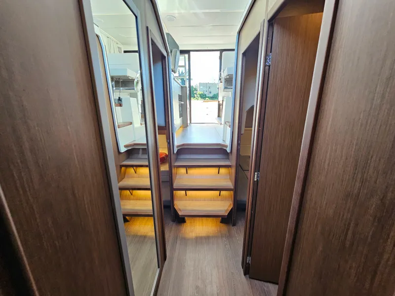 Slide: The Image of Luxurious interior of 2024 Beneteau Antares 12 yacht with wooden finishes and modern design. - 42