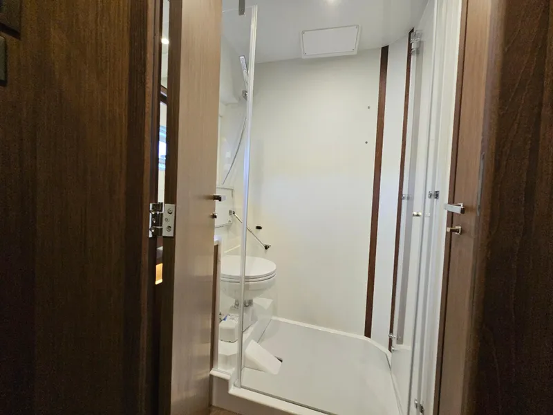 Slide: The Image of 2024 Beneteau Antares 12 bathroom with modern design and wooden accents. - 45