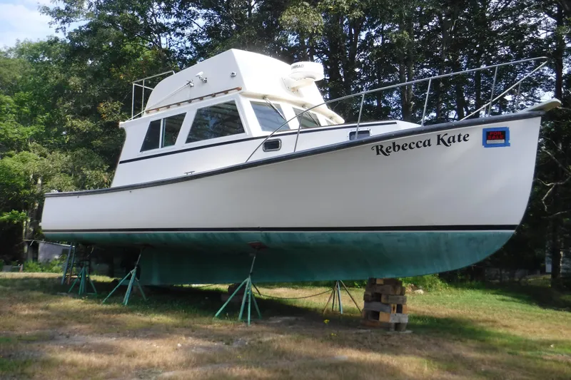 Slide: The Image of 2003 Duffy 35 Downeast Flybridge Cruiser on stands, named "Rebecca Kate," for sale. - 30
