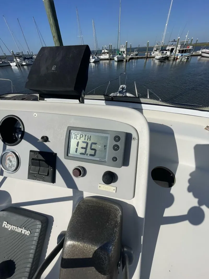 Slide: The Image of Control panel of a 1984 Mainship MK III boat showing depth reading of 13.5 feet. - 23