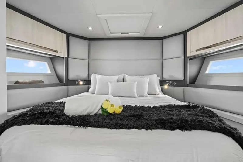 Slide: The Image of Luxurious bedroom interior of 2015 Azimut 55S yacht with modern design and plush bedding. - 15