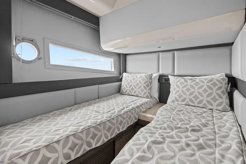 Slide: The Image of Interior of 2015 Azimut 55S yacht with twin beds and modern decor. - 22