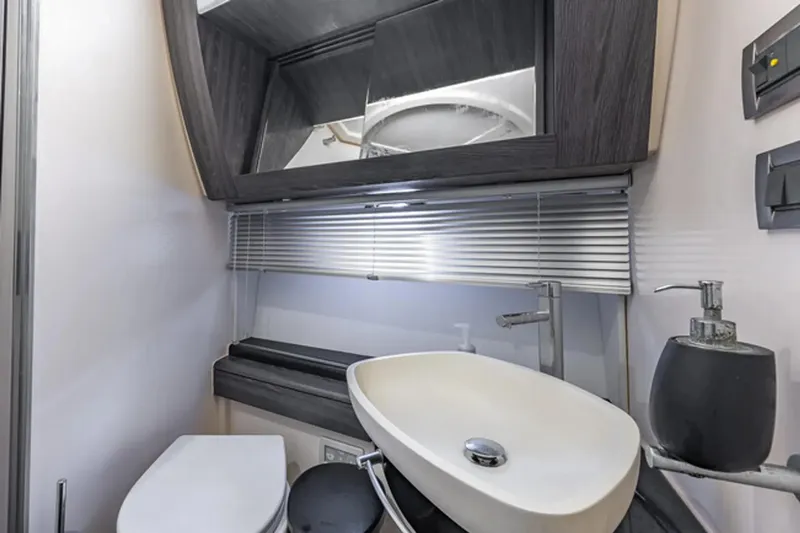 Slide: The Image of Modern bathroom interior of 2015 Azimut 55S yacht with sleek sink and mirror. - 23