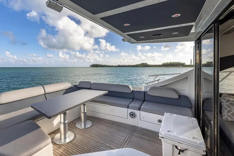 Slide: The Image of Luxurious 2015 Azimut 55S yacht deck with ocean view and comfortable seating. - 6
