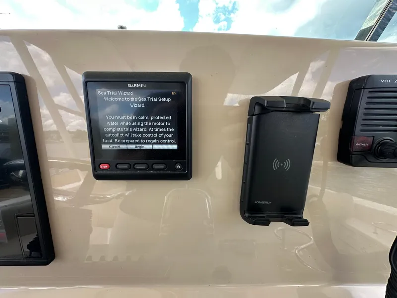 Slide: The Image of Control panel of a 2015 Pursuit ST 310 Sport boat with Garmin Sea Trial Wizard. - 14