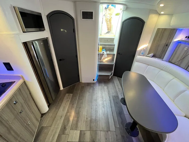 Slide: The Image of Interior of 2000 Cruisers Yachts 3870 Express with modern kitchen and seating area. - 19