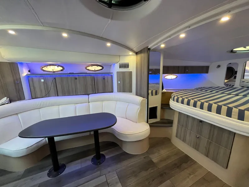 Slide: The Image of Interior of 2000 Cruisers Yachts 3870 Express with modern seating and ambient lighting. - 20