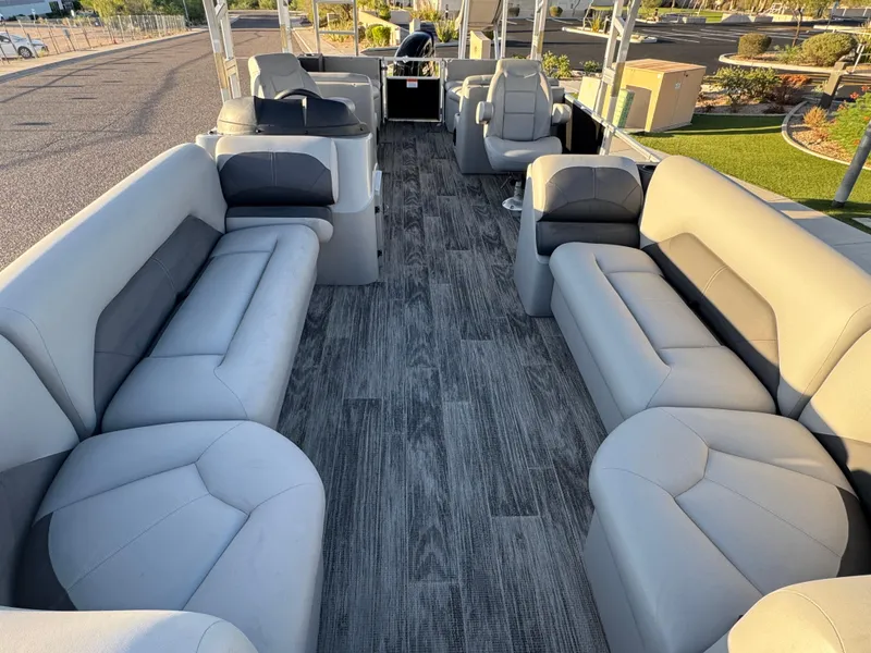 Slide: The Image of 2024 Landau Island Breeze 252 pontoon boat interior with spacious seating and modern design. - 5
