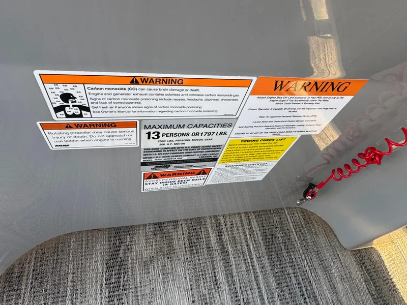 Slide: The Image of Warning labels on 2024 Landau Island Breeze 252, detailing safety and capacity information. - 7