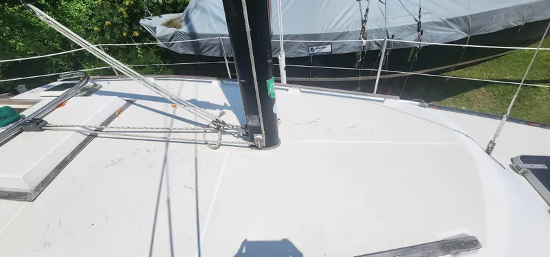 Slide: The Image of Deck of a 1984 Caliber 28 sailboat with rigging and mast. - 19
