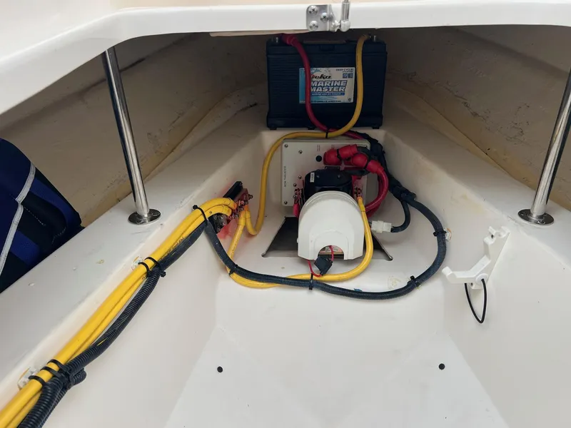 Slide: The Image of 2016 Pursuit 325 DC boat battery compartment with wiring and Marine Master battery. - 26