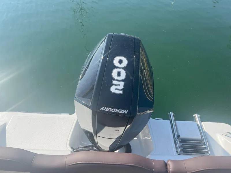 Slide: The Image of Outboard motor on a Reflex Gladiator 2400 boat, 2026 model, in calm water. - 14