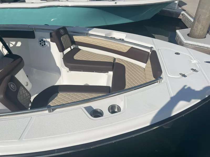 Slide: The Image of Luxurious seating on 2026 Reflex Gladiator 2400 boat, docked with stylish upholstery. - 28