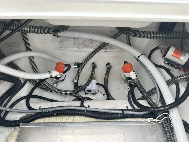 Slide: The Image of Boat engine compartment with wiring and hoses, Reflex Gladiator 2400, 2026 model. - 38